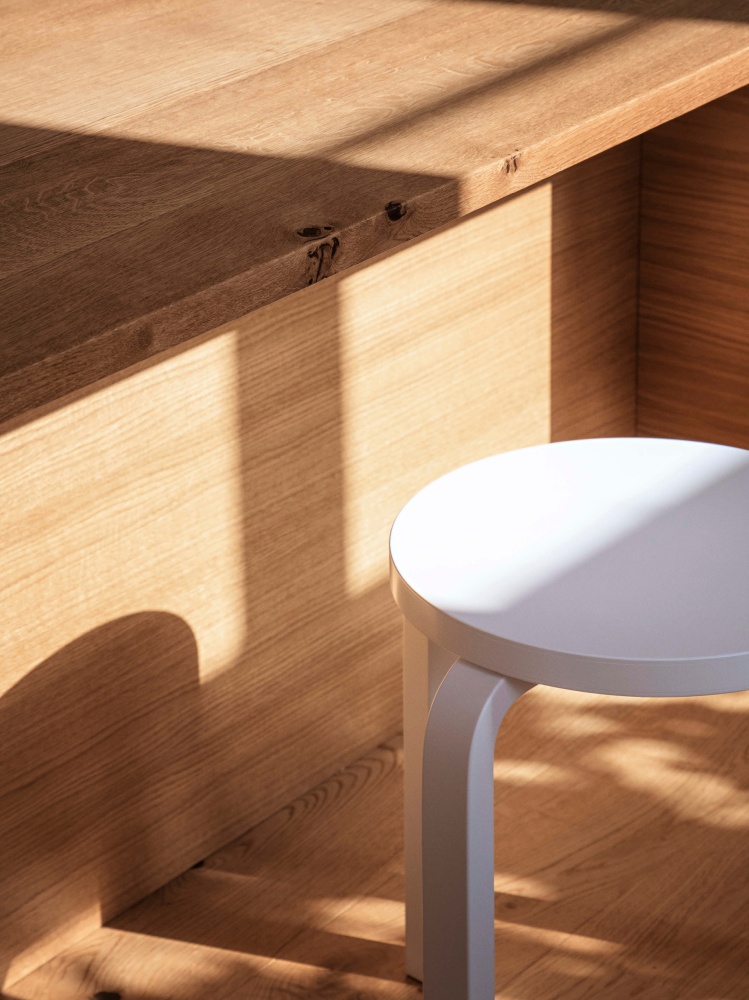 Light wooden table and white stool