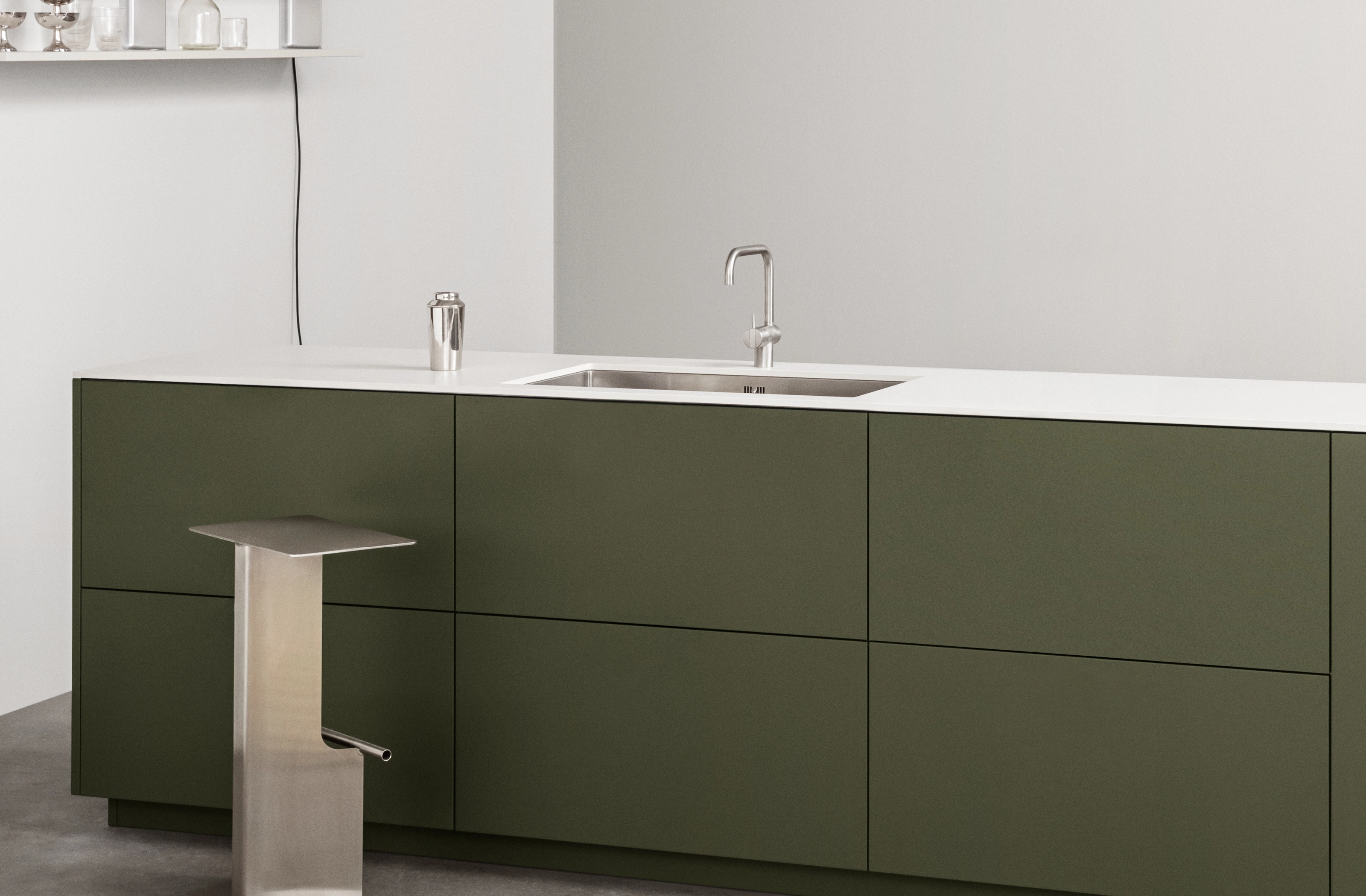 Green kitchen with Compact laminate countertop